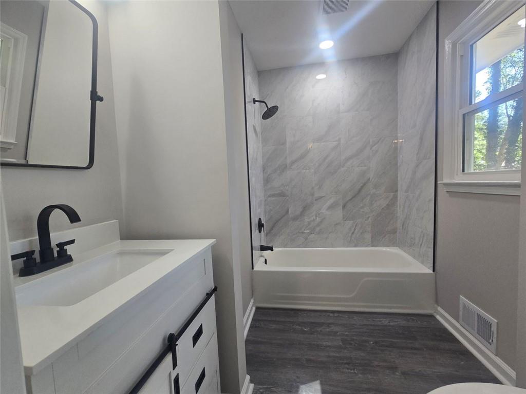 4059 Canby Lane Decatur, GA 30035 - Photo 8 of 18 a bathroom with a sink toilet and shower