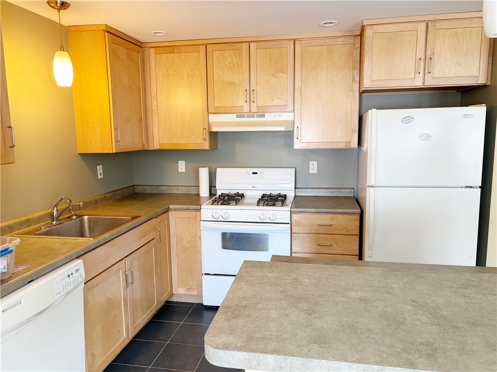 200 Clarke Road, Unit 208 Narragansett, RI 02882 - Photo 7 of 8 maple cabinetry & laminate counters. Center island.