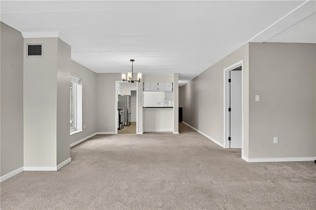 a view of an empty room with a window