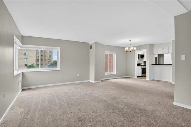 a view of a dining room with furniture and window