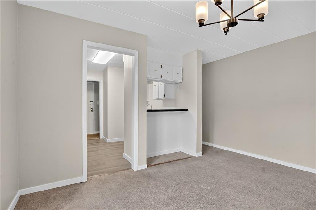 5 Bayard Road, Unit 500 Pittsburgh, PA 15213 - Photo 17 of 45 a view of a kitchen with a refrigerator and a sink