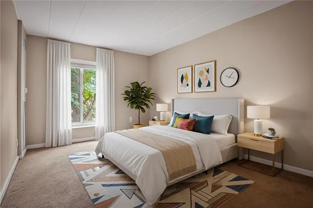 a bedroom with a bed and window