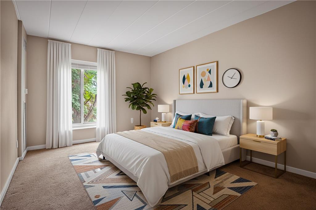 5 Bayard Road, Unit 500 Pittsburgh, PA 15213 - Photo 19 of 45 a bedroom with a large bed and a window