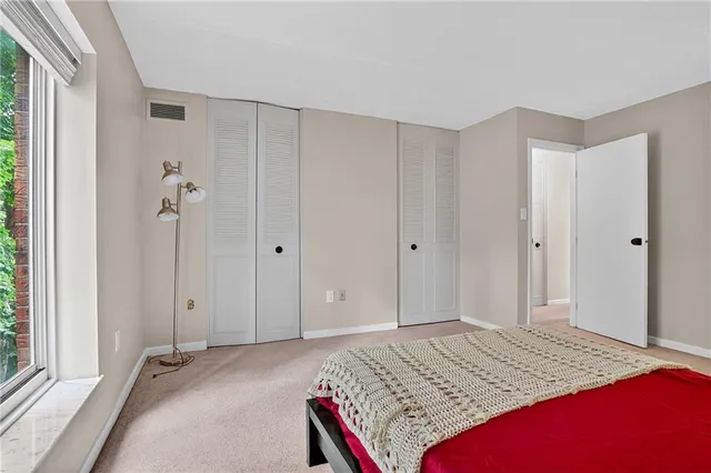 a bathroom with a bathtub shower sink vanity and toilet
