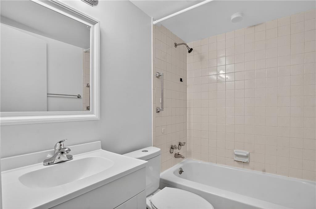 5 Bayard Road, Unit 500 Pittsburgh, PA 15213 - Photo 26 of 45 a bathroom with a bathtub shower sink vanity and toilet