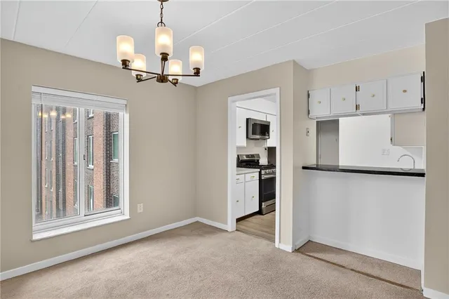a kitchen with granite countertop a sink and cabinets