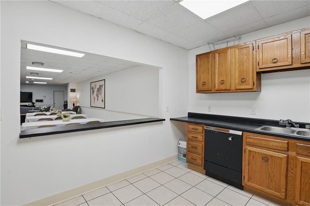 5 Bayard Road, Unit 500 Pittsburgh, PA 15213 - Photo 36 of 45 a kitchen with stainless steel appliances granite countertop a sink and cabinets