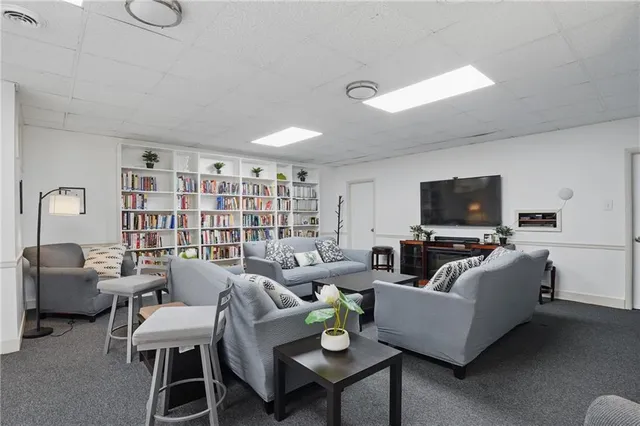 a view of brick house with large windows
