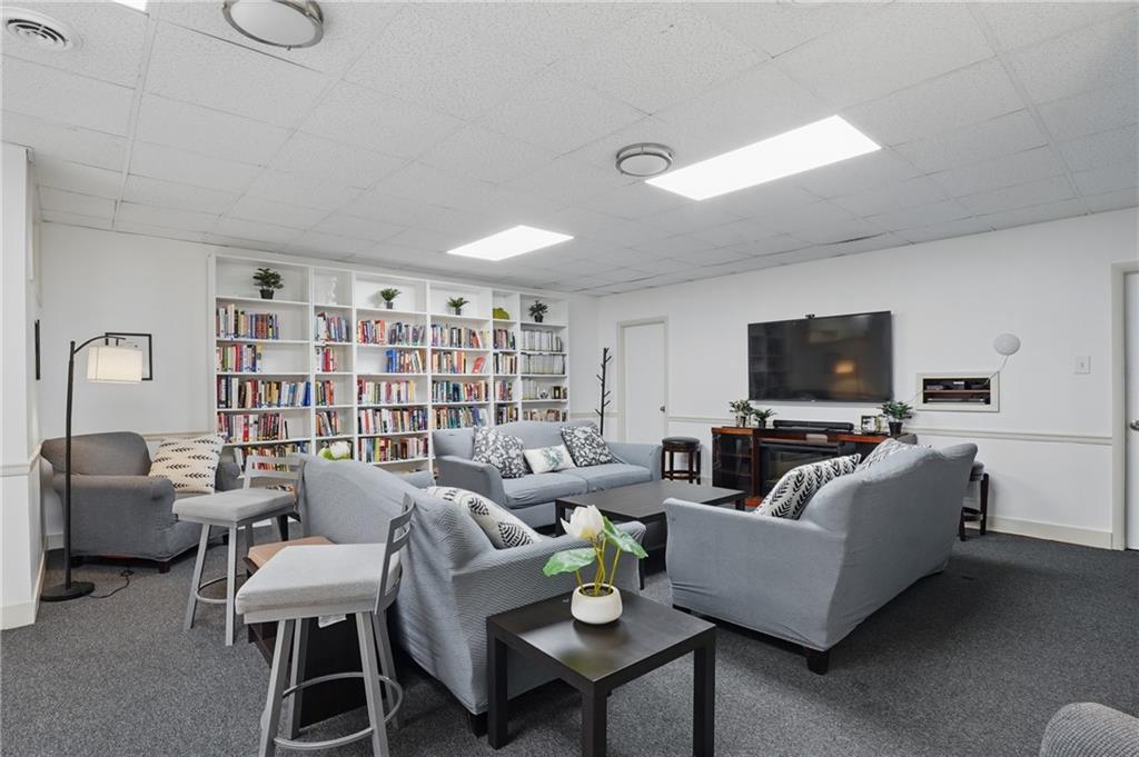 5 Bayard Road, Unit 500 Pittsburgh, PA 15213 - Photo 39 of 45 a living room with furniture and a flat screen tv