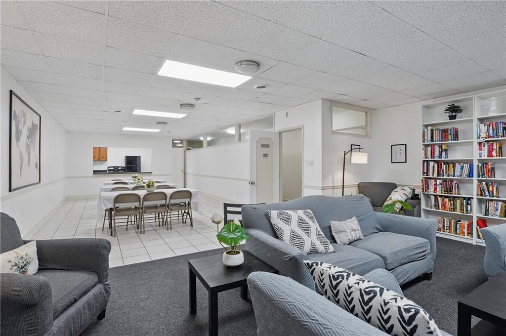 5 Bayard Road, Unit 500 Pittsburgh, PA 15213 - Photo 40 of 45 a living room with furniture and a book shelf