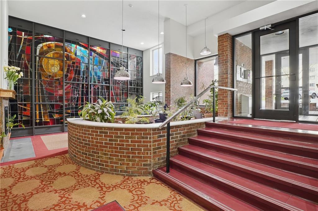 5 Bayard Road, Unit 500 Pittsburgh, PA 15213 - Photo 4 of 45 a living room filled with furniture and a floor to ceiling window