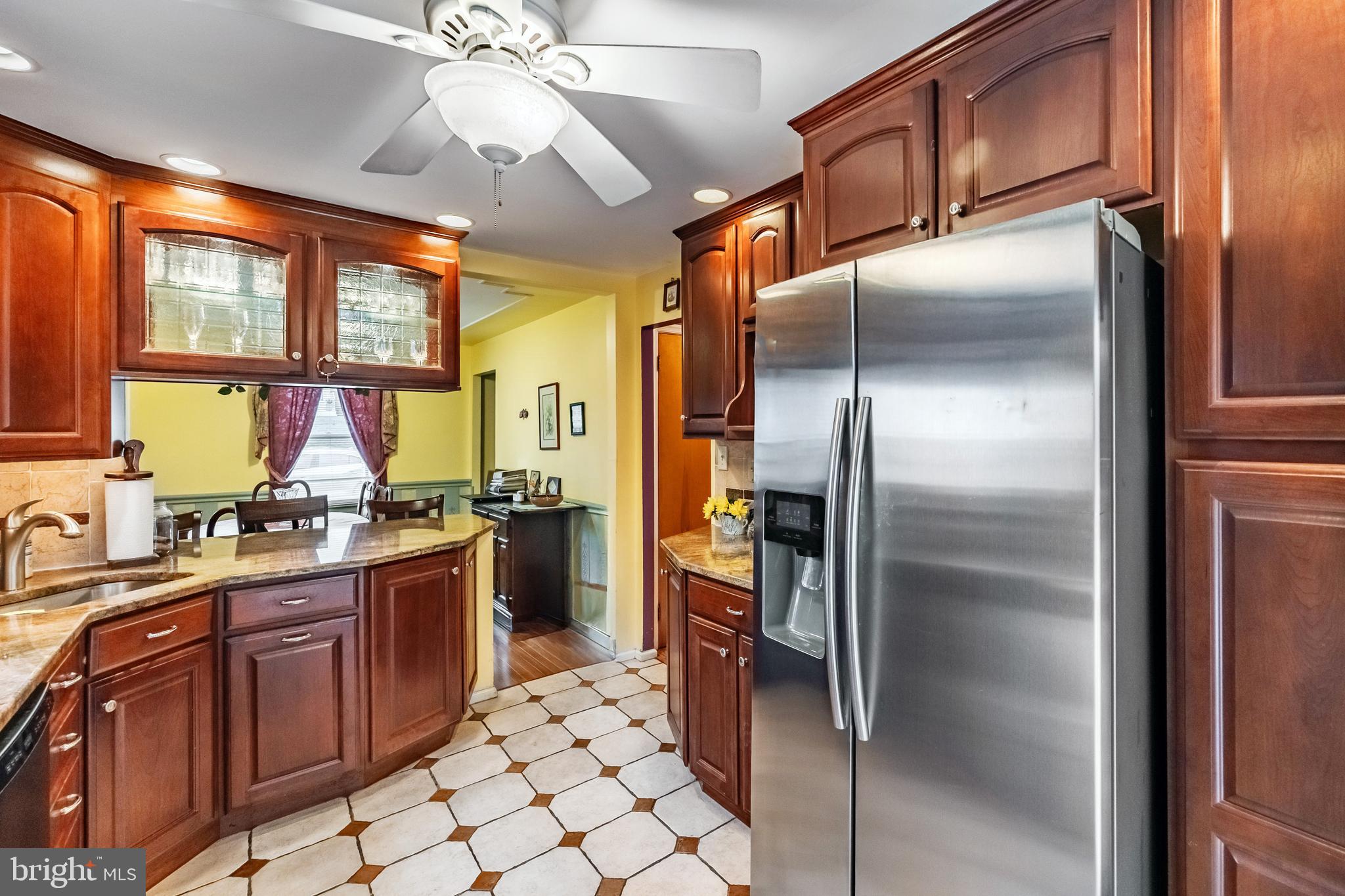 212 Golf Hills Road Havertown, PA 19083 - Photo 12 of 37 a kitchen with stainless steel appliances granite countertop a refrigerator and a sink
