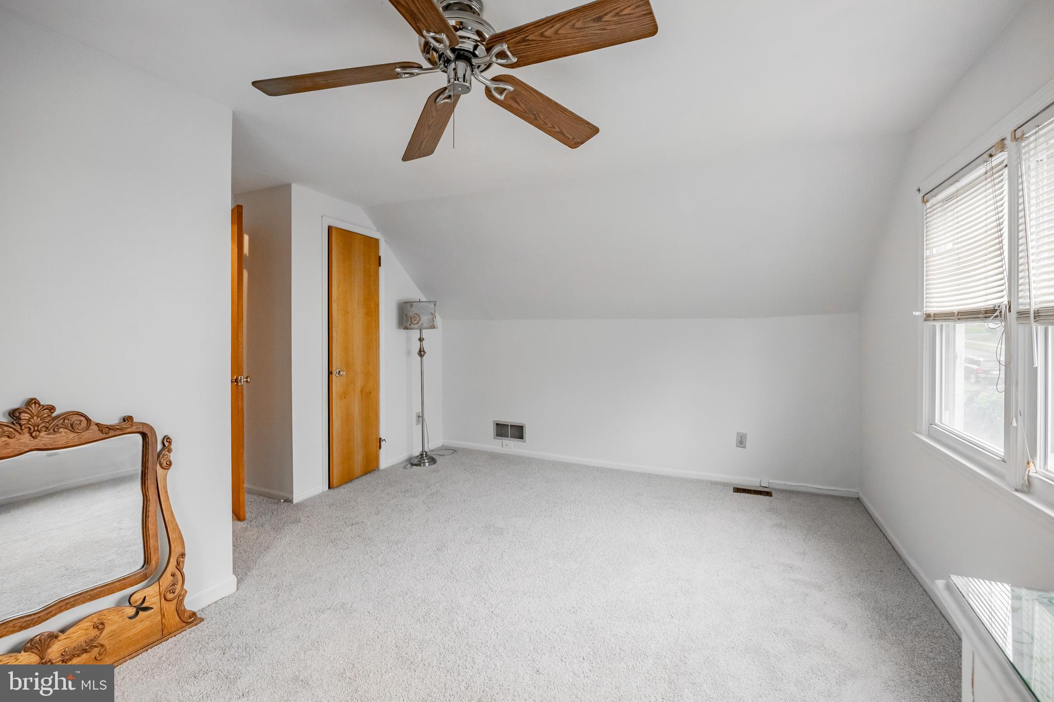 212 Golf Hills Road Havertown, PA 19083 - Photo 17 of 37 an empty room with windows and fan