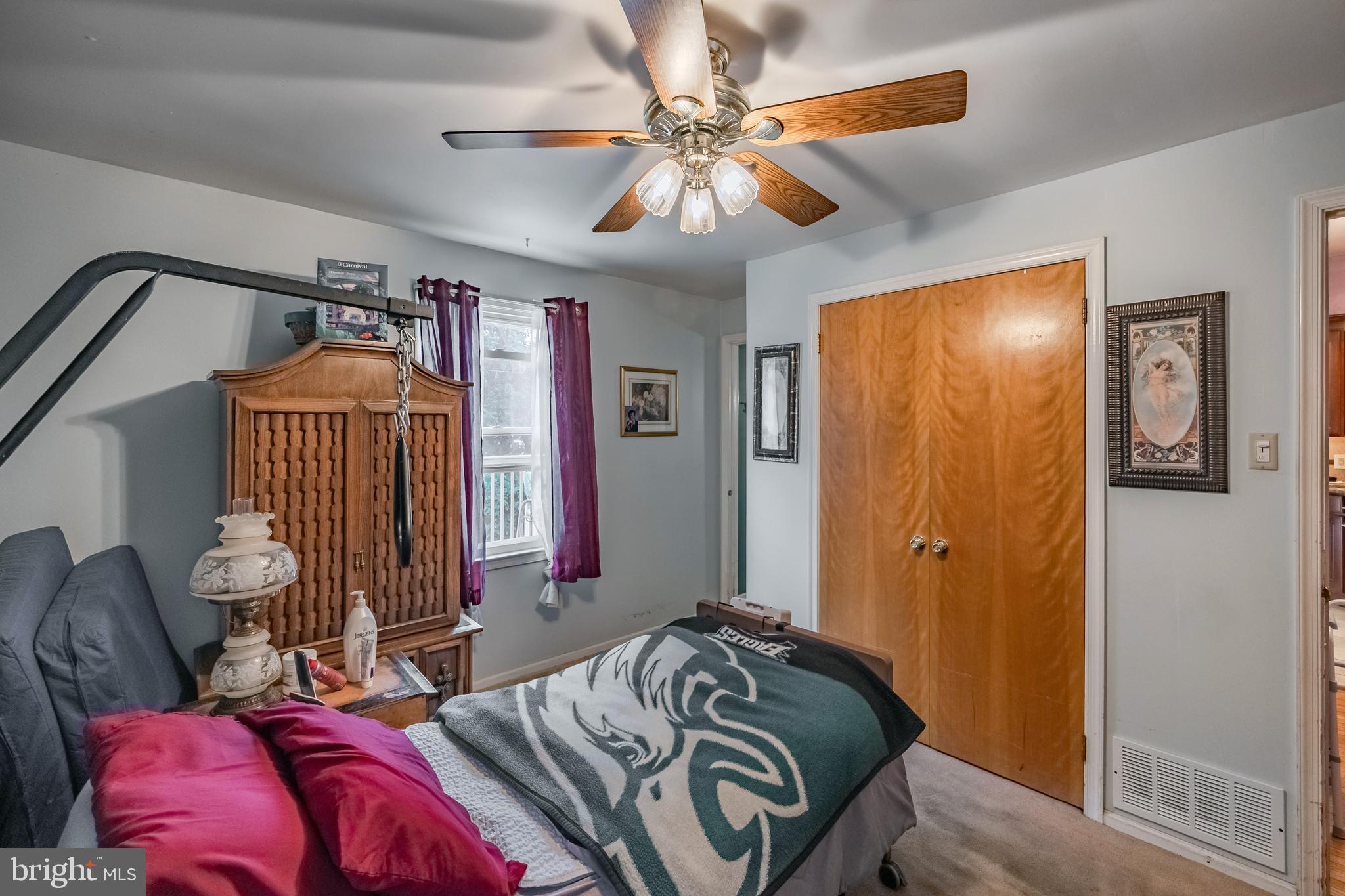 212 Golf Hills Road Havertown, PA 19083 - Photo 22 of 37 a bed room with a bed and a chandelier