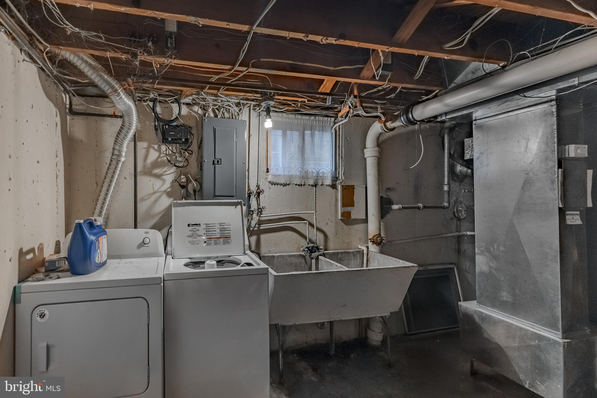 212 Golf Hills Road Havertown, PA 19083 - Photo 25 of 37 a kitchen with a sink a refrigerator and cabinets