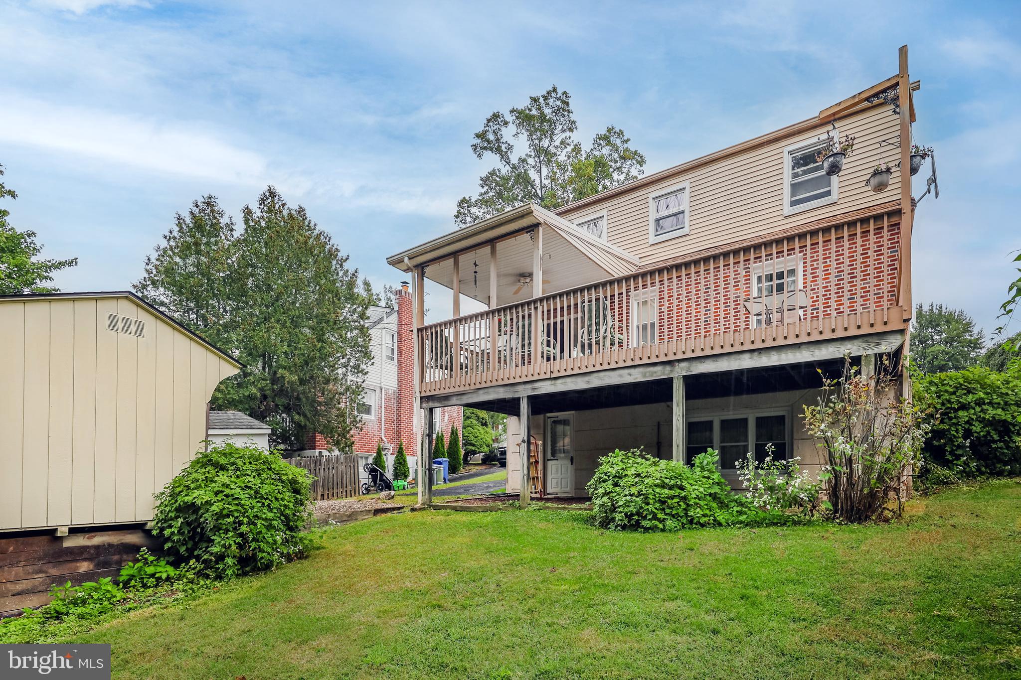 212 Golf Hills Road Havertown, PA 19083 - Photo 36 of 37 a view of a house with a yard and potted plants