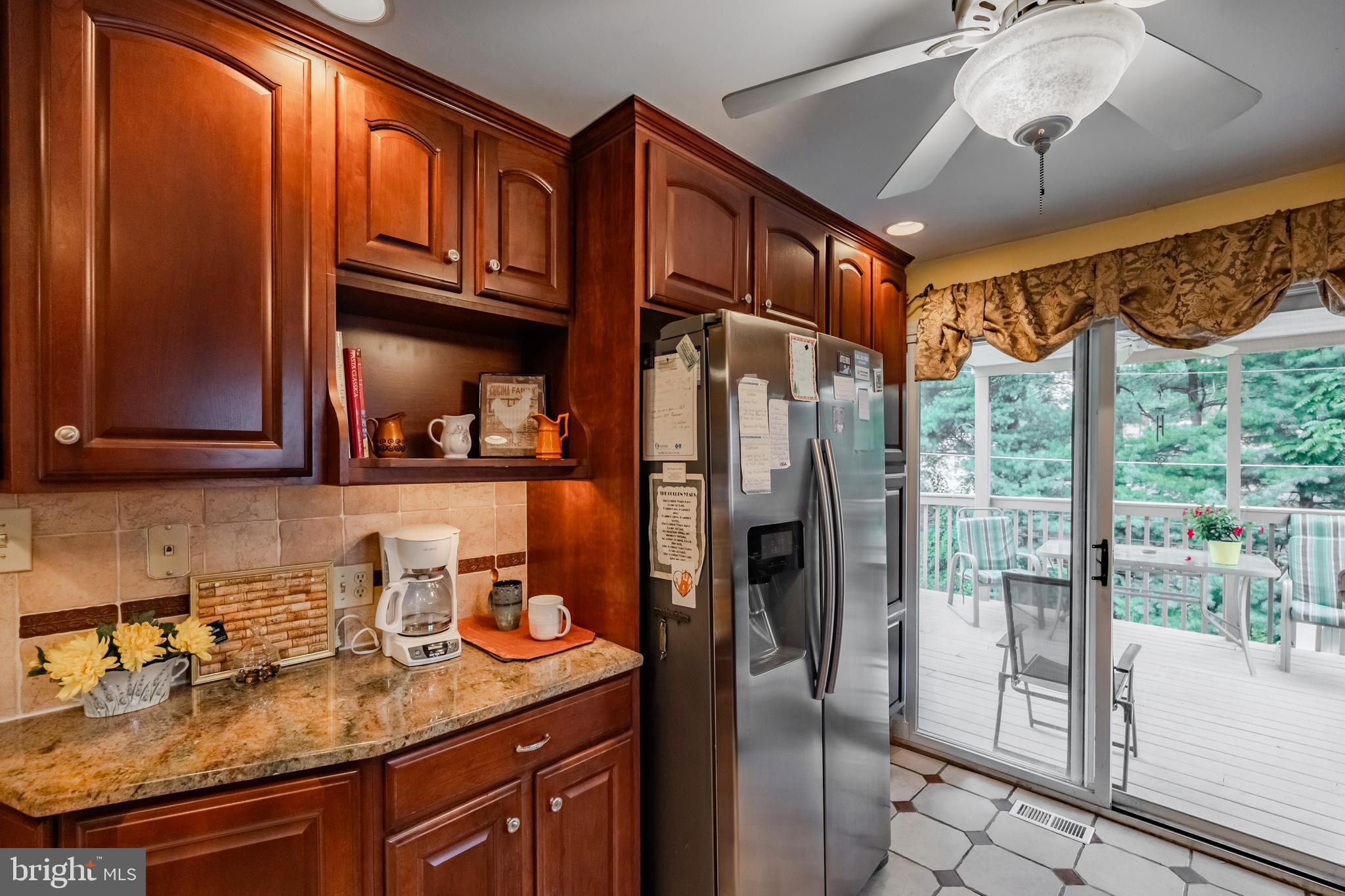 212 Golf Hills Road Havertown, PA 19083 - Photo 9 of 37 a kitchen with stainless steel appliances granite countertop a refrigerator and a sink
