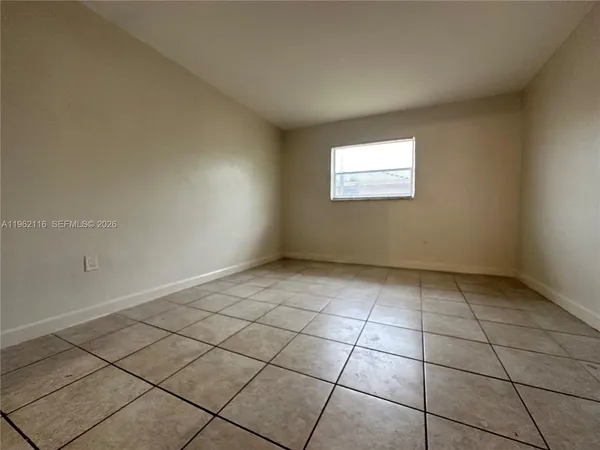 a view of an empty room and window