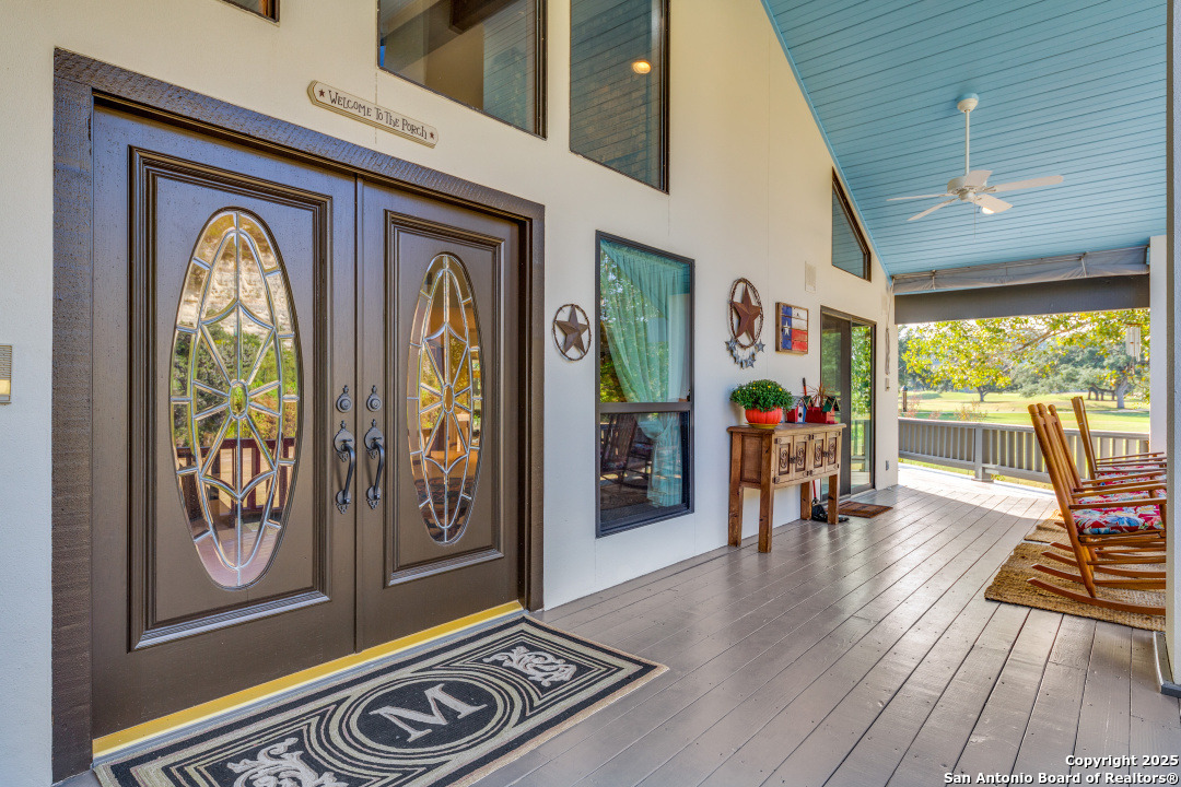 a view of front door with wooden floor and furniture