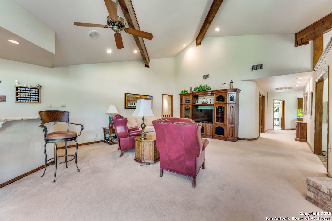 122 Cliffdwellers Path Boerne, TX 78006 - Photo 4 of 35 a view of a livingroom with furniture and a flat screen tv
