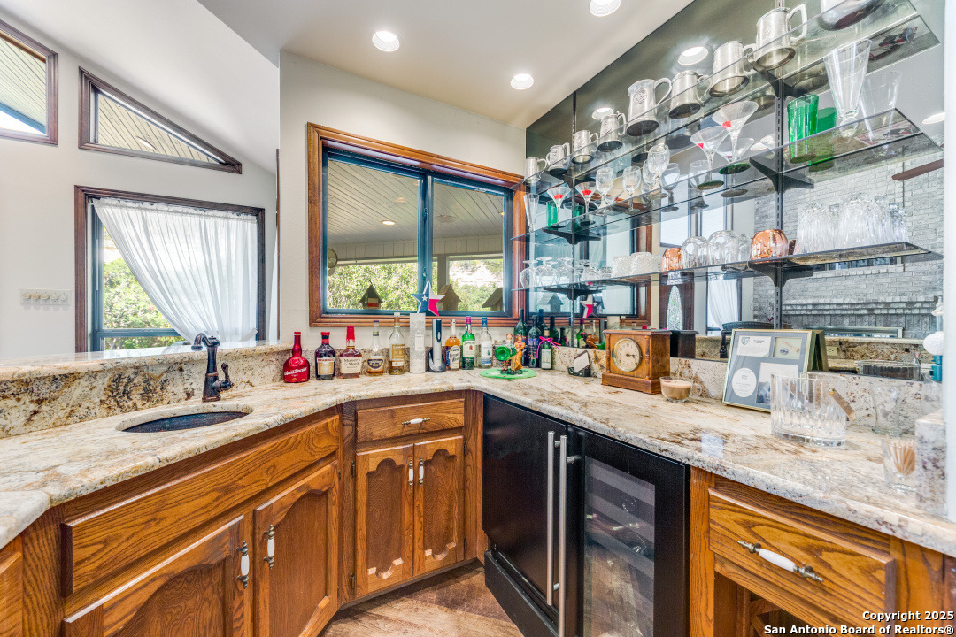 122 Cliffdwellers Path Boerne, TX 78006 - Photo 6 of 35 a kitchen with stainless steel appliances granite countertop a sink stove and cabinets