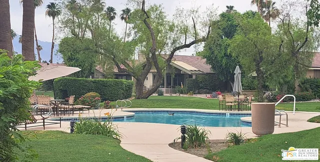 a view of a park with large trees