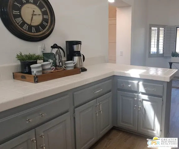 a view of a kitchen with dining table and chairs