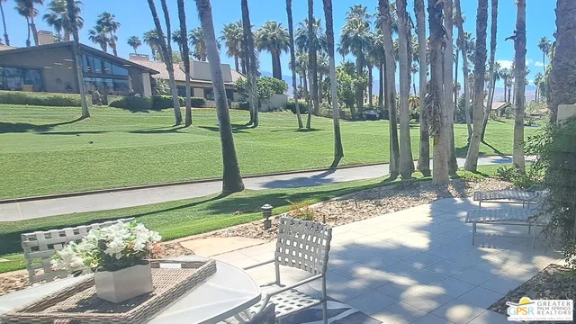 a living room with a couch and a view of a bathroom