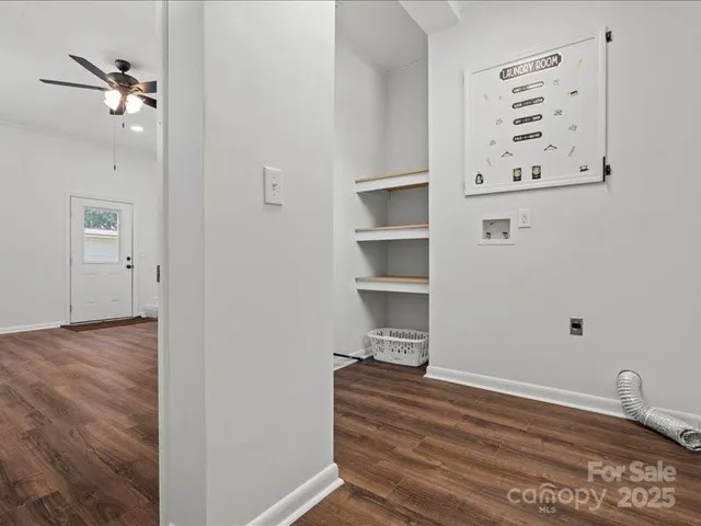 a view of a bedroom with a hardwood floor