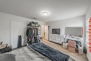 a bedroom with furniture and a window