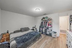 a bedroom with a bed and a walk in closet
