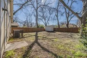 a view of backyard and trees