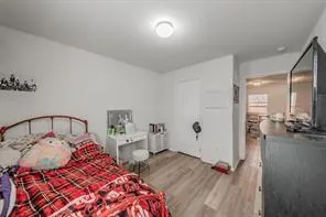 a bedroom with a bed and a view of bathroom