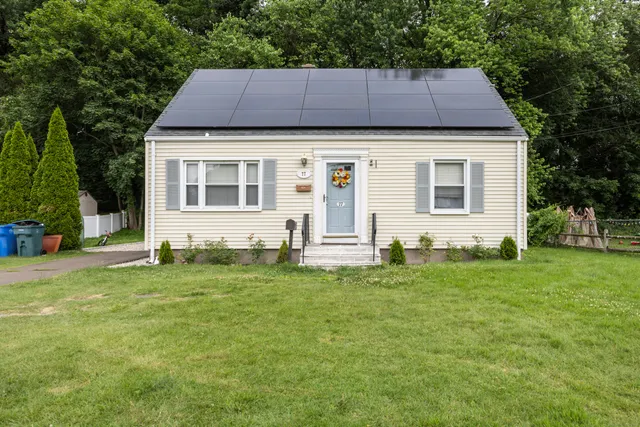 a front view of a house with a yard