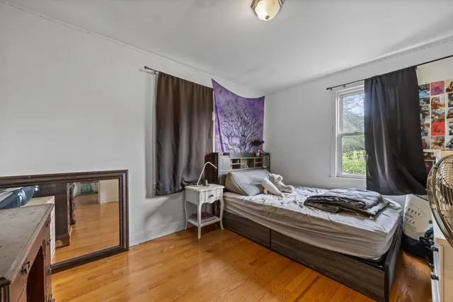 a bedroom with furniture and a window