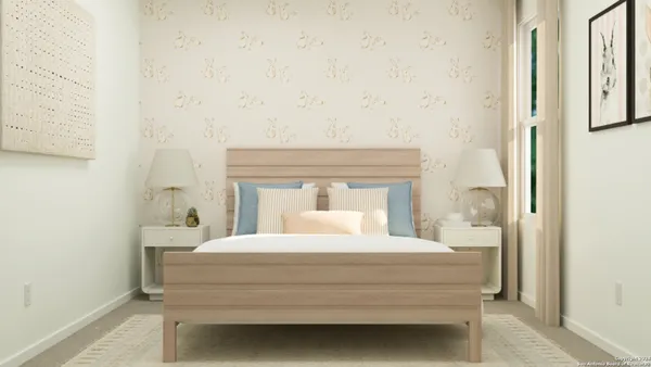 a bedroom with a bed and a mirror