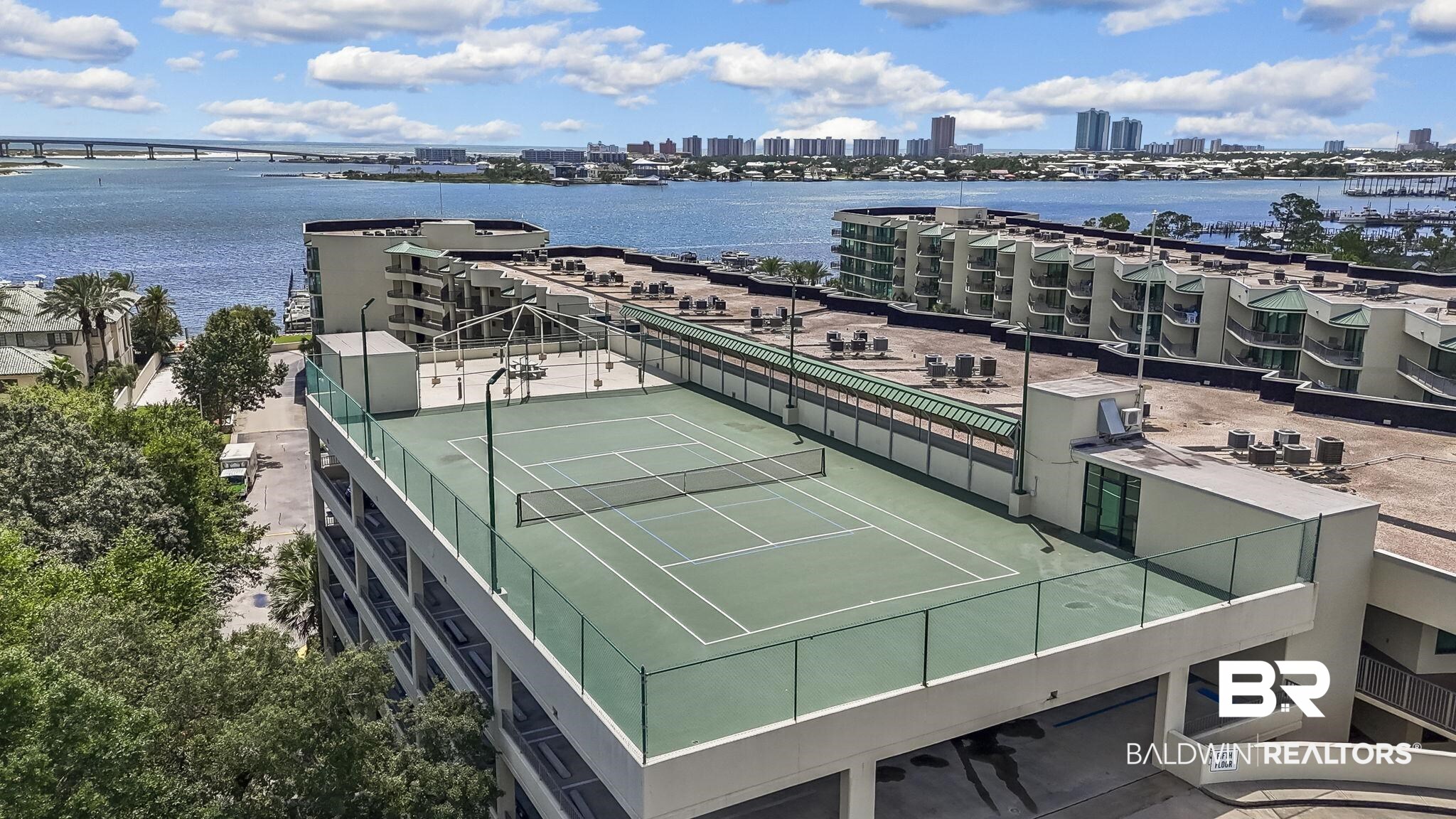 27580 Canal Road, Unit 1526 Orange Beach, AL 36561 - Photo 47 of 49 View of tennis court with a water view and a city view