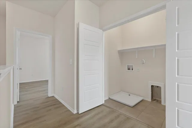 an empty room with wooden floor