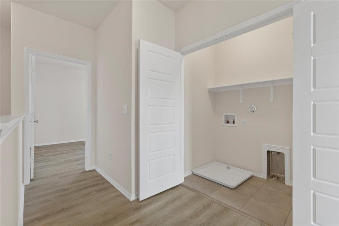 128 Dodge Road Georgetown, TX 78626 - Photo 13 of 18 an empty room with wooden floor