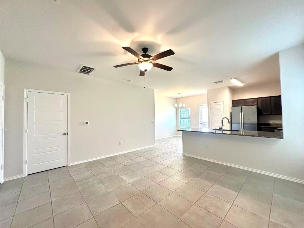 128 Dodge Road Georgetown, TX 78626 - Photo 5 of 18 a view of kitchen with furniture and a ceiling fan