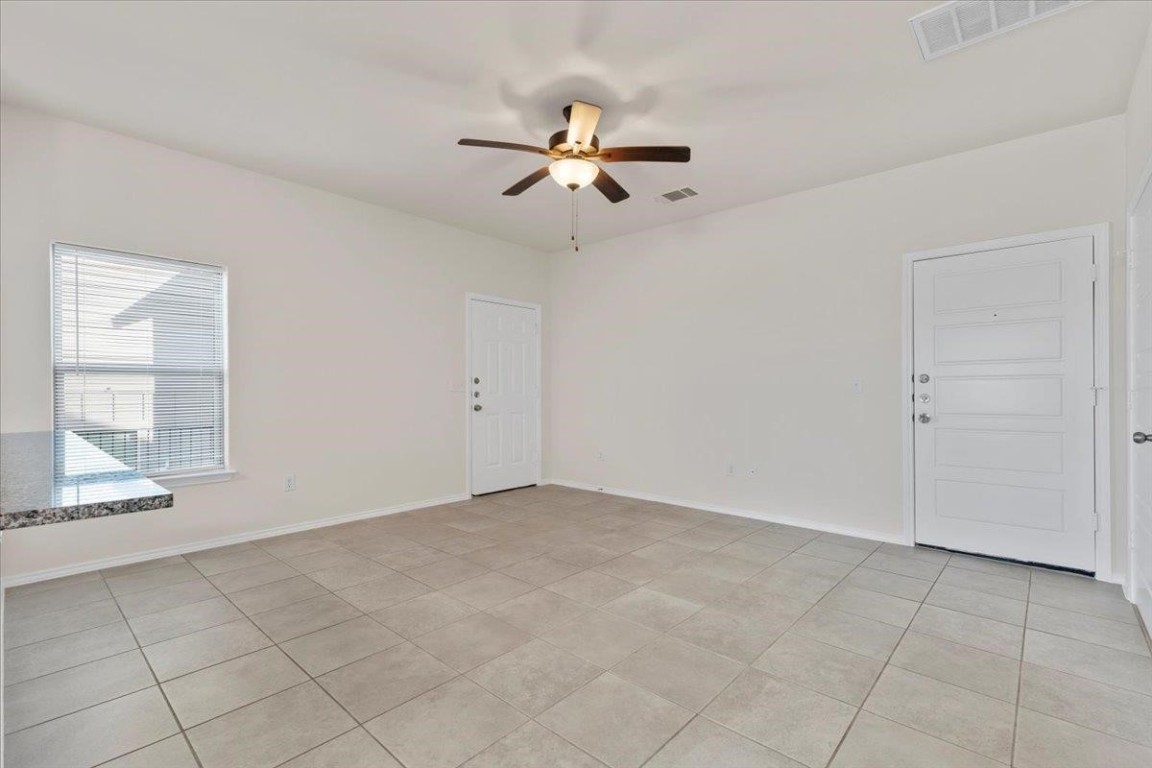 128 Dodge Road Georgetown, TX 78626 - Photo 8 of 18 a view of an empty room with a window