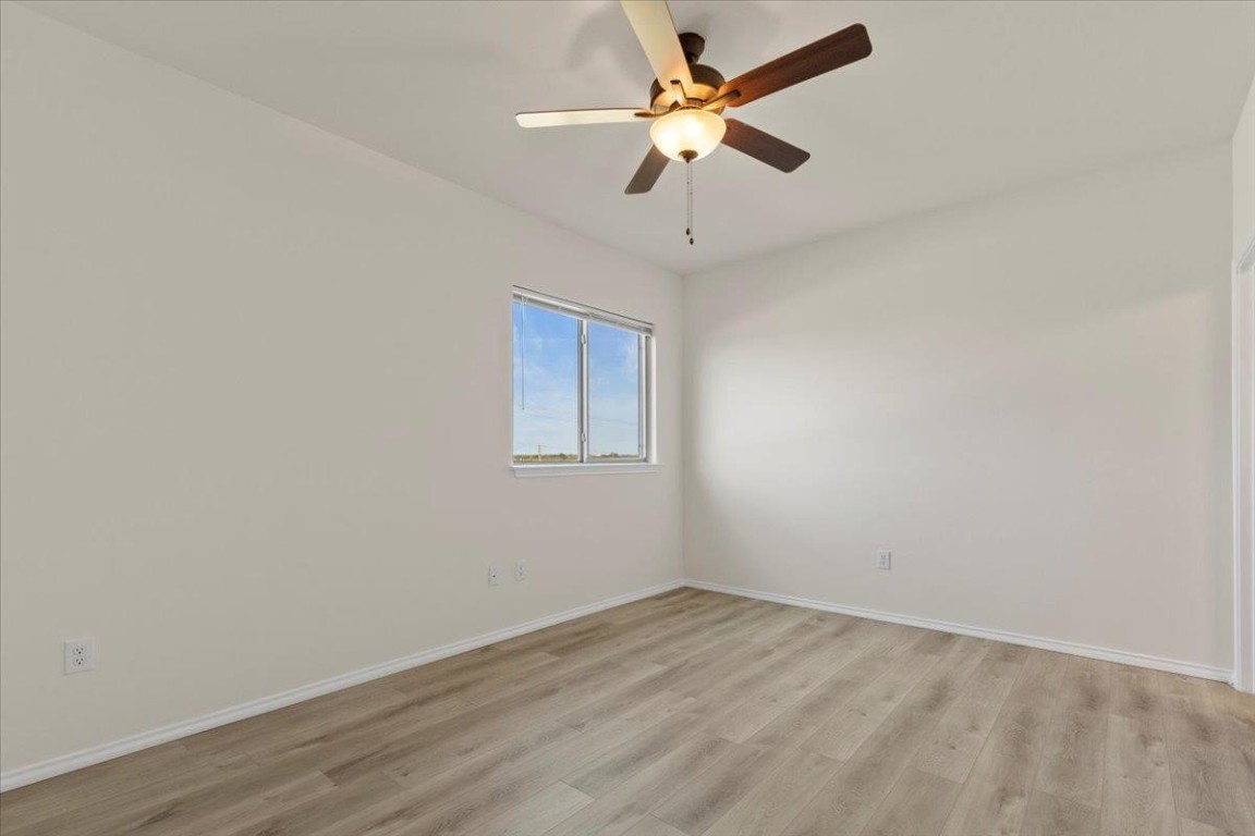128 Dodge Road Georgetown, TX 78626 - Photo 10 of 18 an empty room with a window and a fan