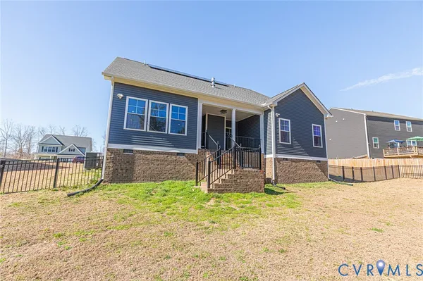 a house view with swimming pool in front of it