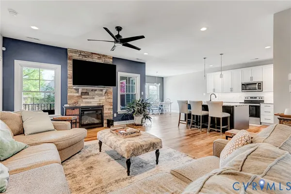a living room with furniture fireplace and a flat screen tv