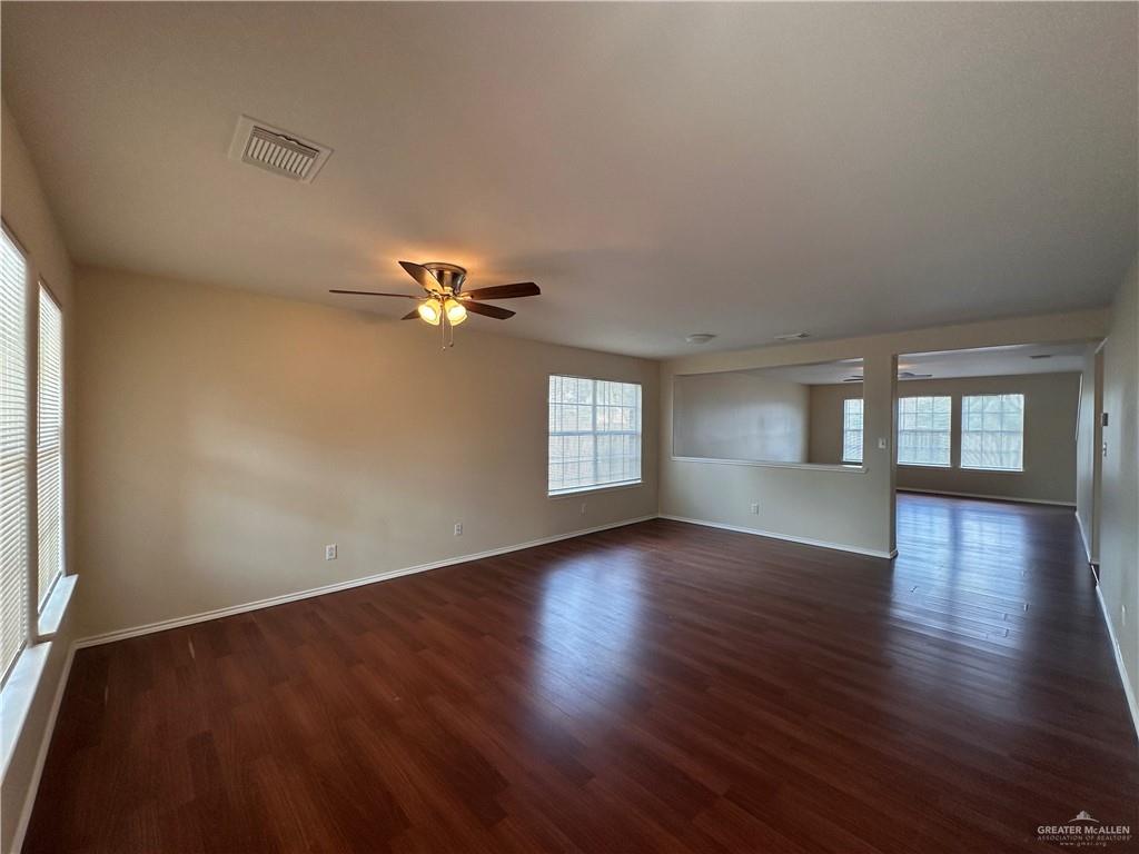 819 Briarwood Drive Mission, TX 78574 - Photo 2 of 19 a view of empty room with wooden floor and fan
