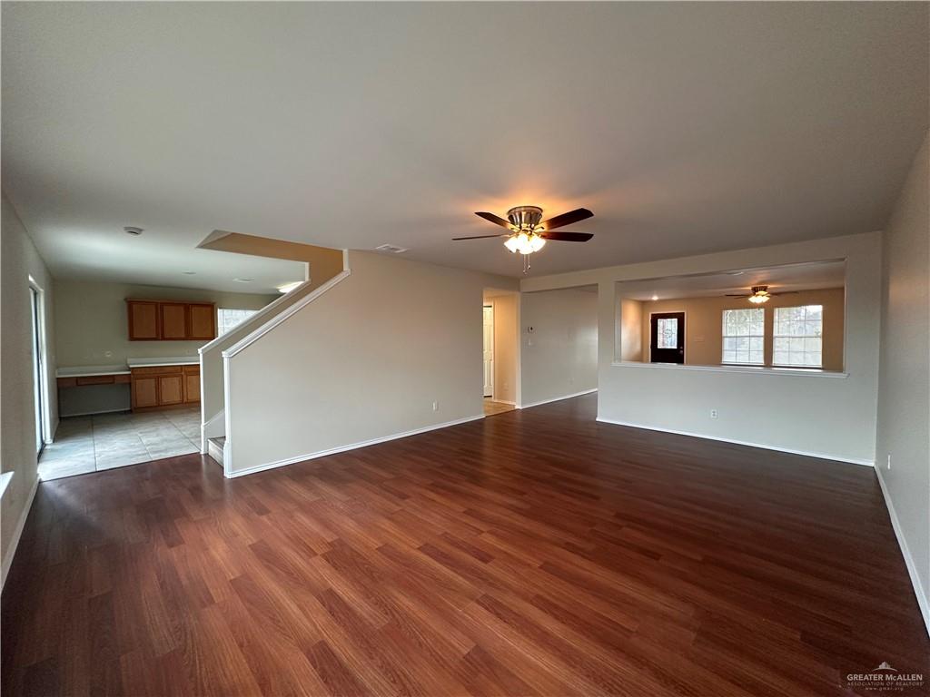 819 Briarwood Drive Mission, TX 78574 - Photo 4 of 19 a view of an empty room with wooden floor and a window