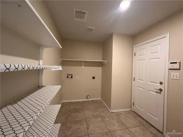 a view of a room with white walls