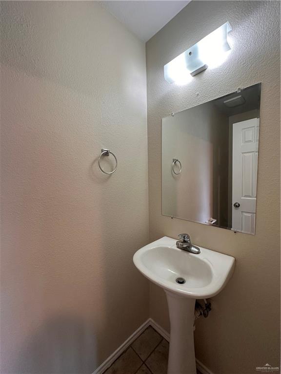 819 Briarwood Drive Mission, TX 78574 - Photo 8 of 19 a bathroom with a sink and a mirror