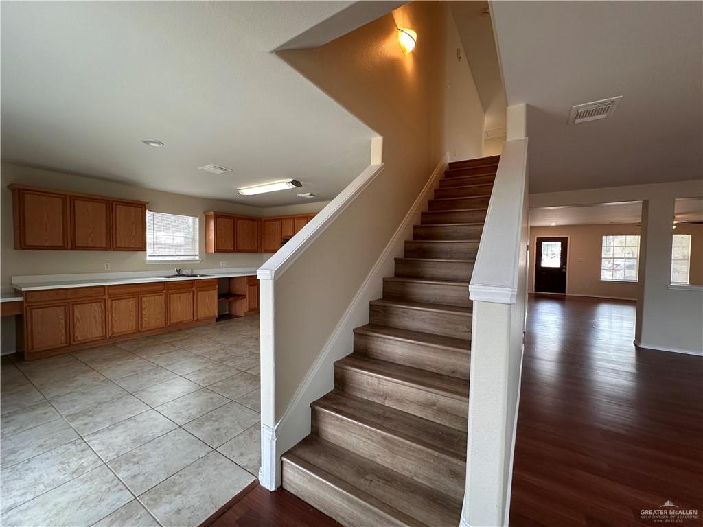 819 Briarwood Drive Mission, TX 78574 - Photo 9 of 19 a view of an entryway with wooden floor and stairs
