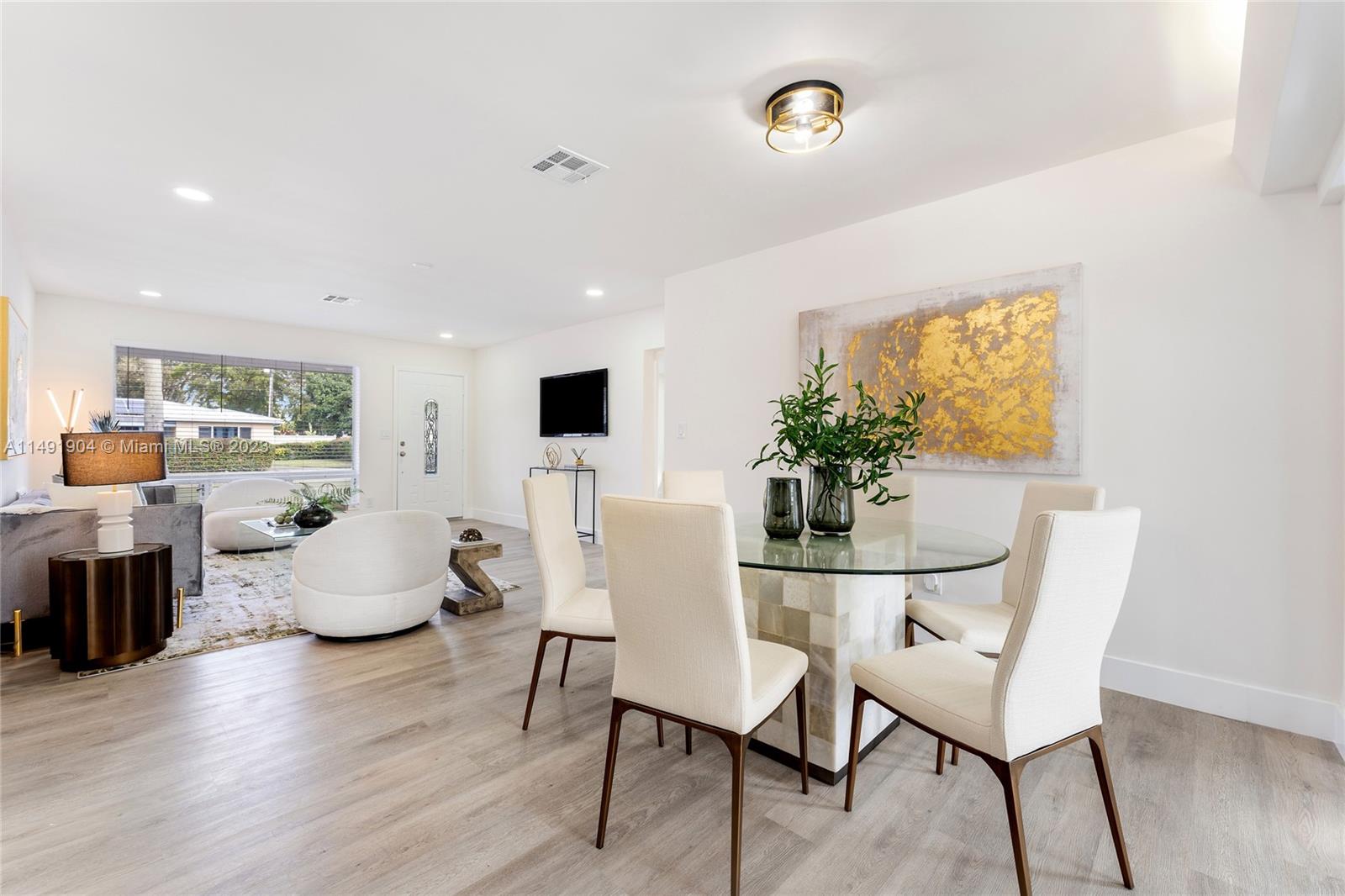 3254 Lincoln Street Hollywood, FL 33021 - Photo 15 of 27 a dining room with furniture and wooden floor